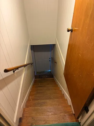 a view of a patio with table and chairs and potted plants