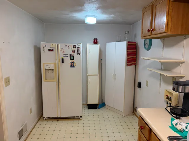 a bathroom with a toilet and shower