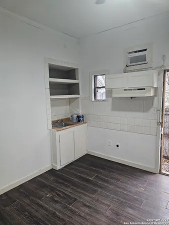 a view of kitchen and wooden floor