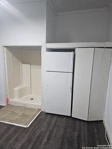 an empty room with wooden floor