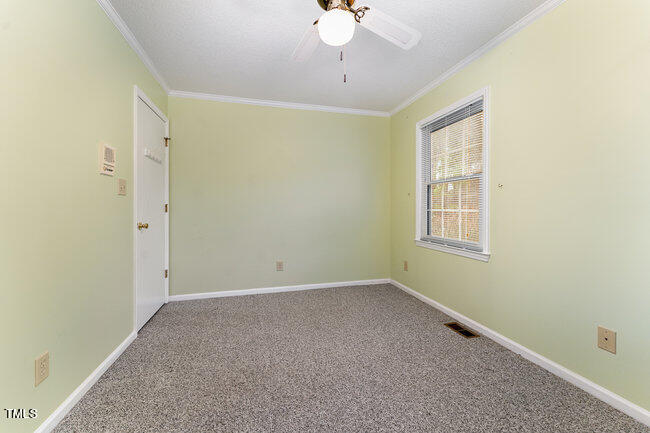 6693 Silk Hope Liberty Road Siler City, NC 27344 - Photo 19 of 32 a view of an empty room with a window