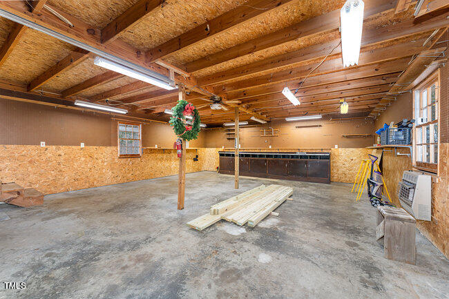 6693 Silk Hope Liberty Road Siler City, NC 27344 - Photo 24 of 32 a view of a room with storage
