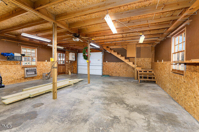 6693 Silk Hope Liberty Road Siler City, NC 27344 - Photo 25 of 32 a view of a room with wooden walls