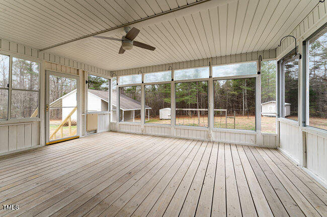6693 Silk Hope Liberty Road Siler City, NC 27344 - Photo 27 of 32 a view of outdoor space with wooden floor and windows
