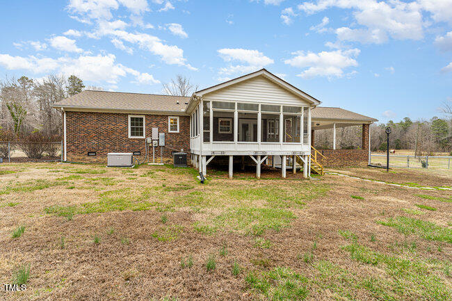 6693 Silk Hope Liberty Road Siler City, NC 27344 - Photo 30 of 32 a front view of a house with a yard