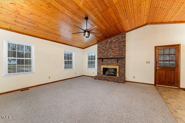 6693 Silk Hope Liberty Road Siler City, NC 27344 - Photo 8 of 32 a view of empty room with windows