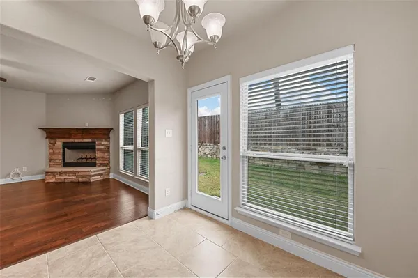 a view of livingroom with hardwood floor and a fireplace