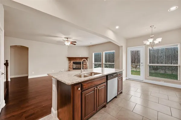 a kitchen with a stove and a sink