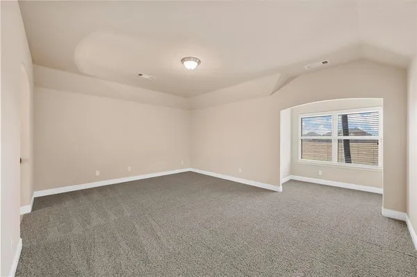 an empty room with a empty space and windows