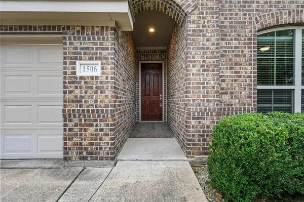 a view of entryway with a brick wall