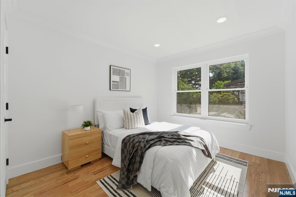275 Longview Road Union, NJ 07083 - Photo 17 of 43 a bed sitting in a bedroom next to a window