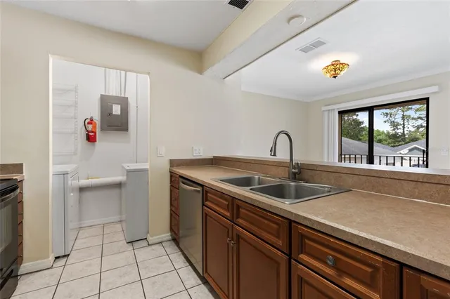 a kitchen with a sink and cabinets