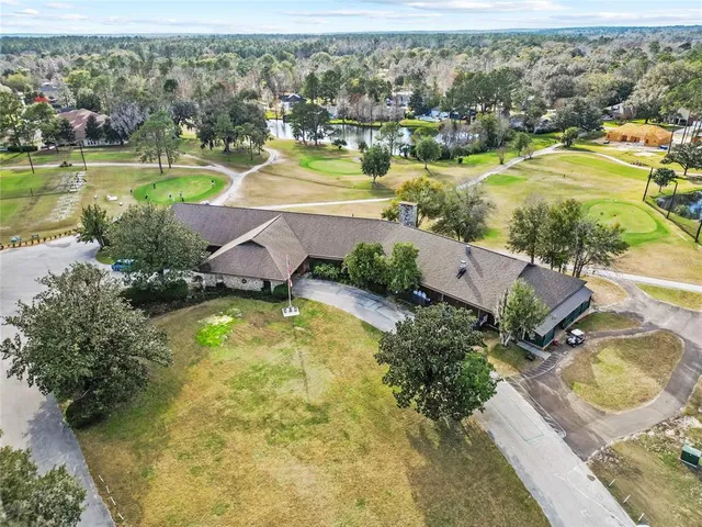 an aerial view of a residential houses with outdoor space