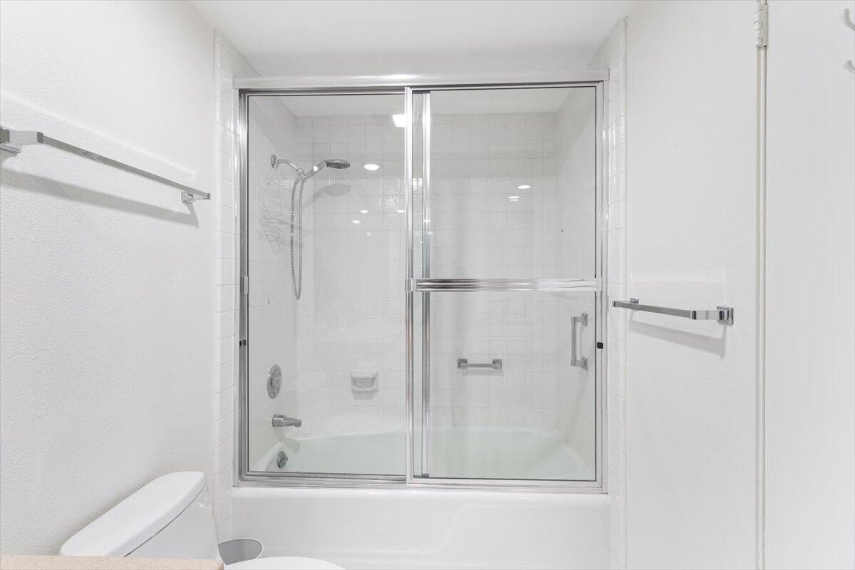 900 Island Drive, Unit 313 Rancho Mirage, CA 92270 - Photo 30 of 62 a bathroom with a glass shower door