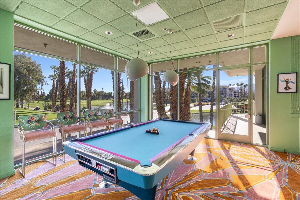 900 Island Drive, Unit 313 Rancho Mirage, CA 92270 - Photo 52 of 62 a room with pool table and windows