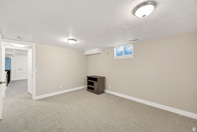 80 North 500 West Logan, UT 84321 - Photo 23 of 36 Wall-to-wall carpeting, recessed window, and flush mount ceiling lighting