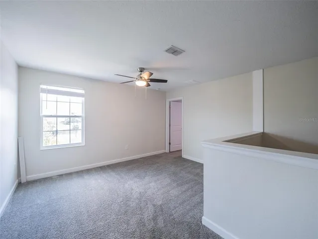 a bathroom with a shower sink and mirror