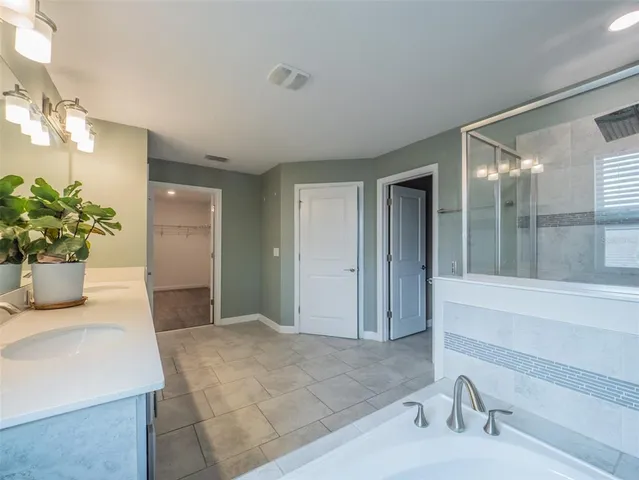 a room with a bed furniture and a window