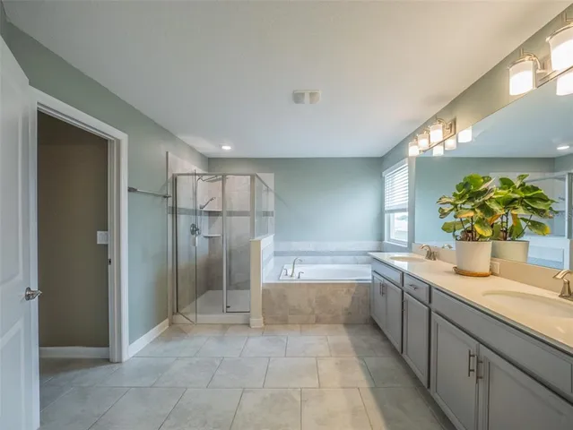 a room with a bed and a chandelier