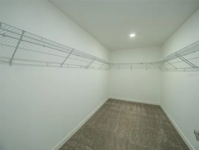 a kitchen with a refrigerator and a sink