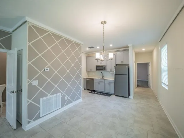 a living room with furniture and a table