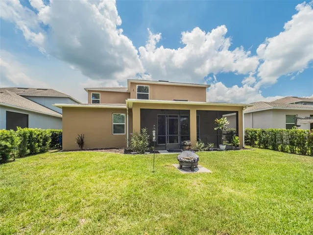 a living room with furniture potted plant and a window
