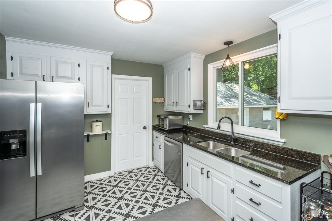 1025 Andros Road Richmond, VA 23225 - Photo 14 of 37 a kitchen with granite countertop a sink stainless steel appliances and window