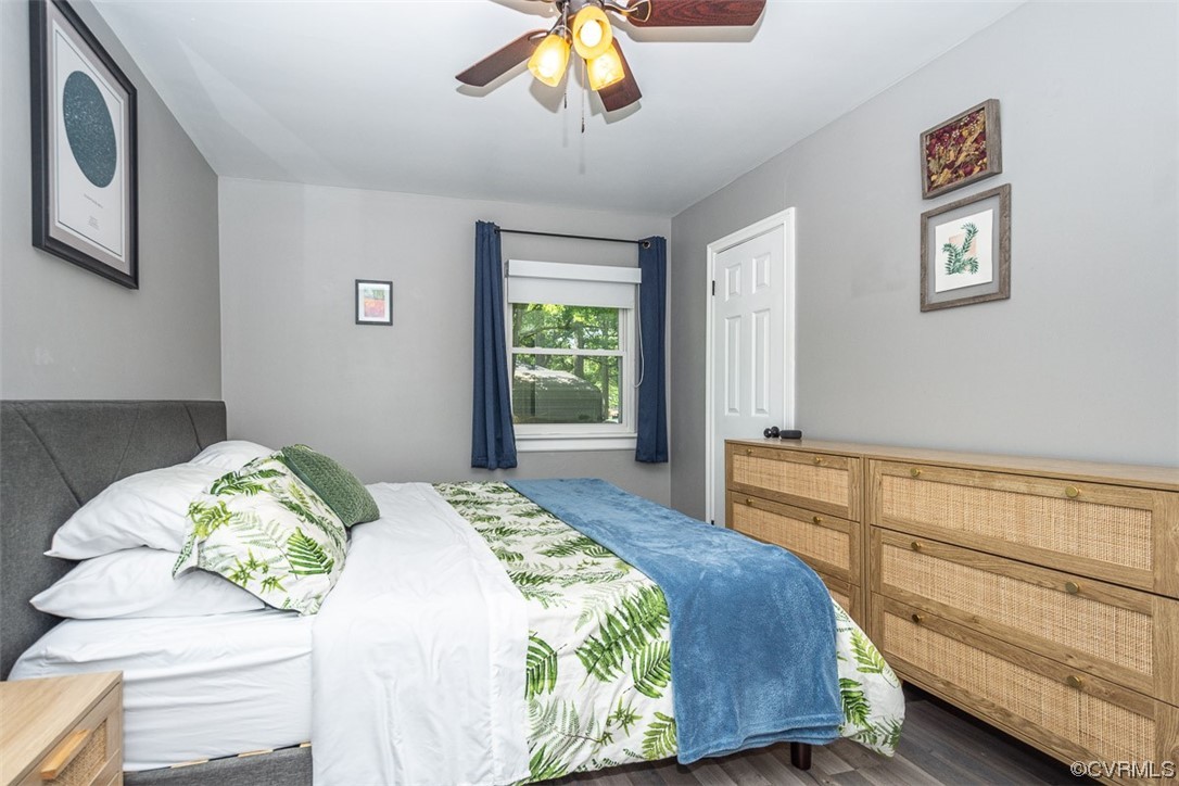 1025 Andros Road Richmond, VA 23225 - Photo 16 of 37 a bedroom with a bed and a chandelier