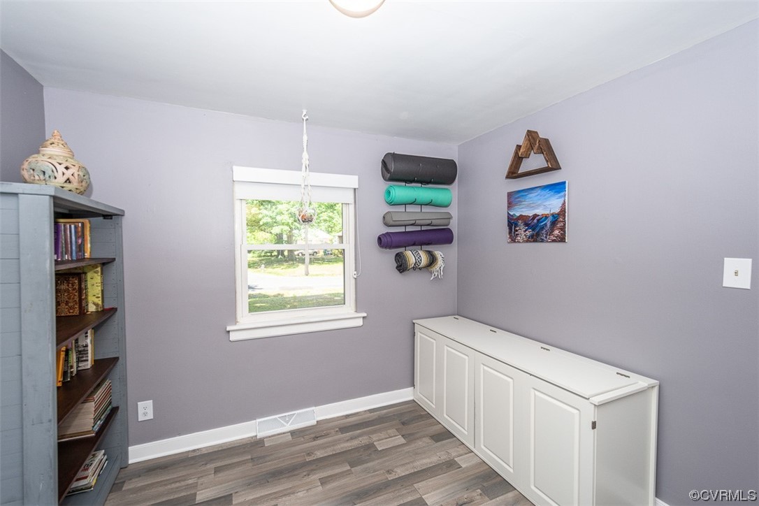 1025 Andros Road Richmond, VA 23225 - Photo 21 of 37 a view of hallway with window and wooden floor