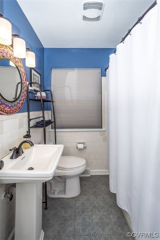1025 Andros Road Richmond, VA 23225 - Photo 24 of 37 a bathroom with a toilet a sink and mirror