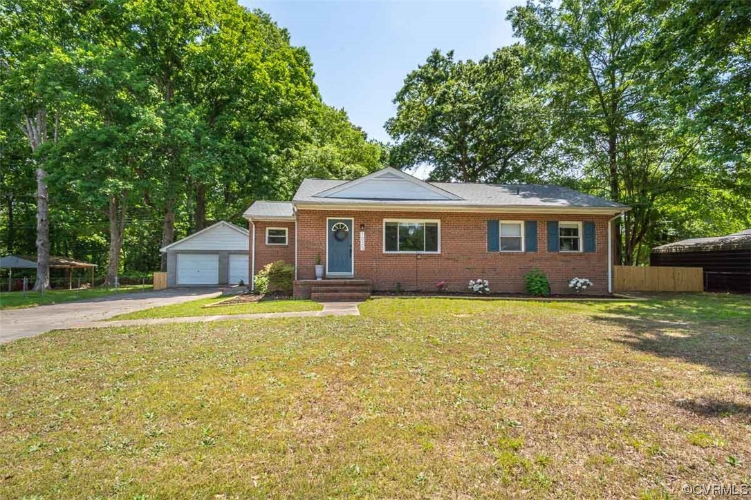 1025 Andros Road Richmond, VA 23225 - Photo 3 of 37 a front view of a house with a garden