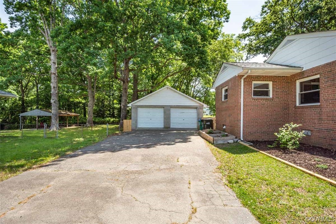 1025 Andros Road Richmond, VA 23225 - Photo 31 of 37 a front view of a house with a yard and porch