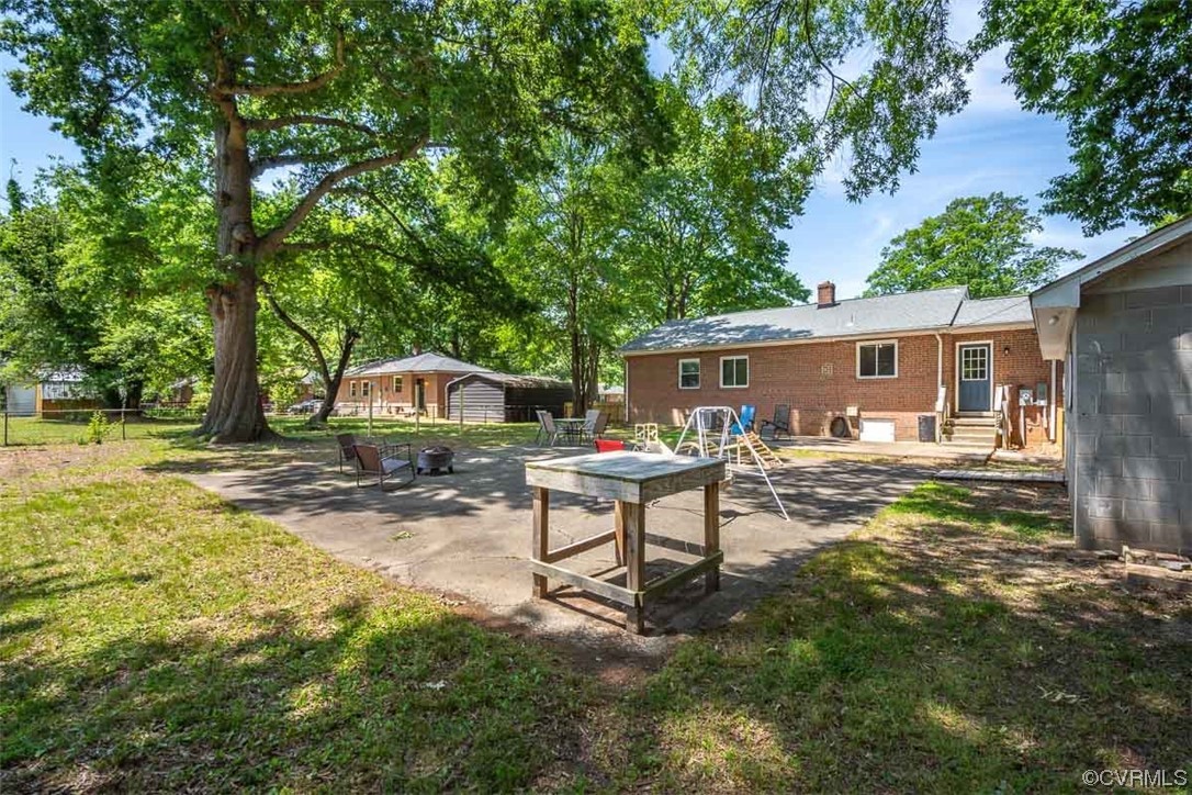 1025 Andros Road Richmond, VA 23225 - Photo 35 of 37 a view of a house with backyard and a tree
