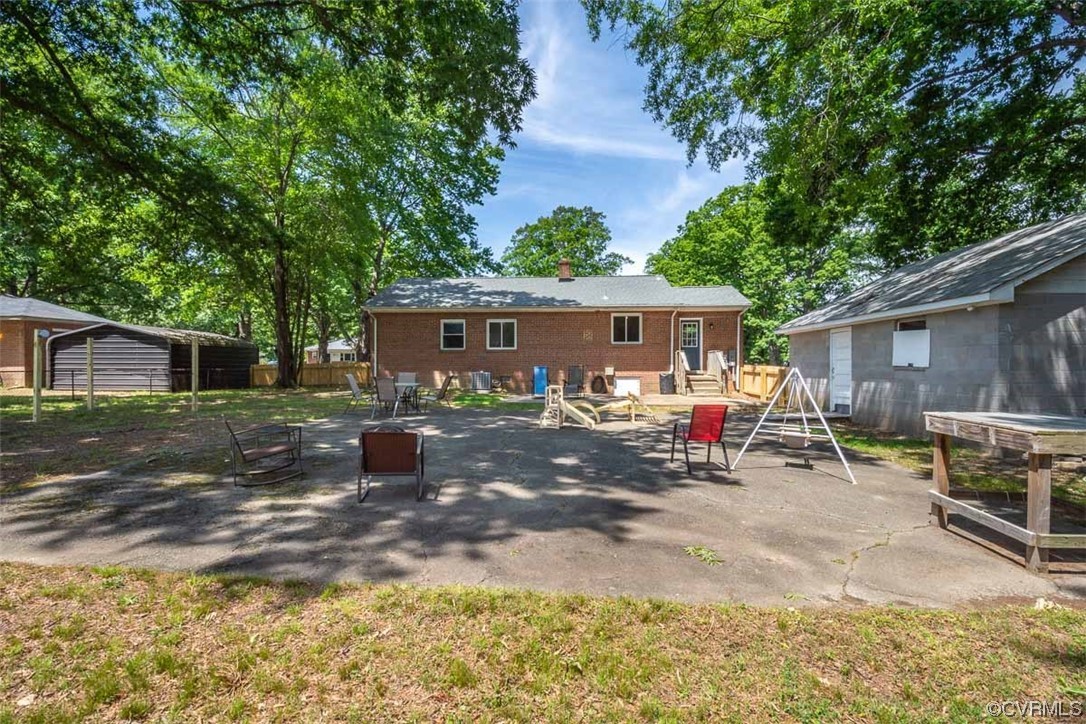 1025 Andros Road Richmond, VA 23225 - Photo 36 of 37 a view of a house with backyard and sitting area