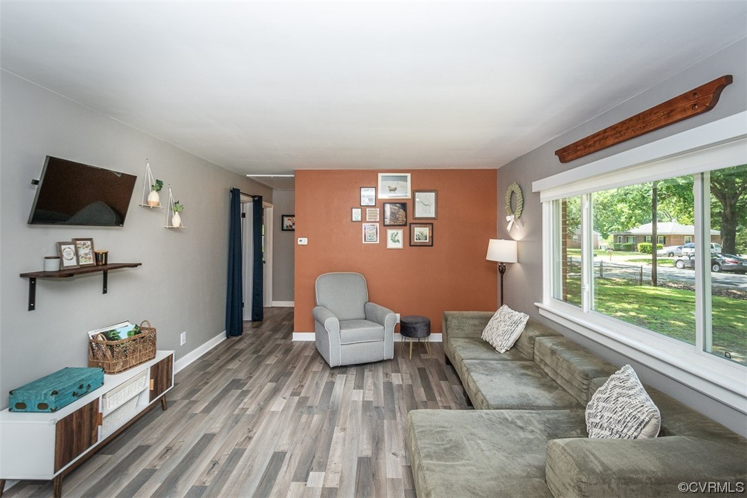 1025 Andros Road Richmond, VA 23225 - Photo 6 of 37 a living room with furniture and a flat screen tv