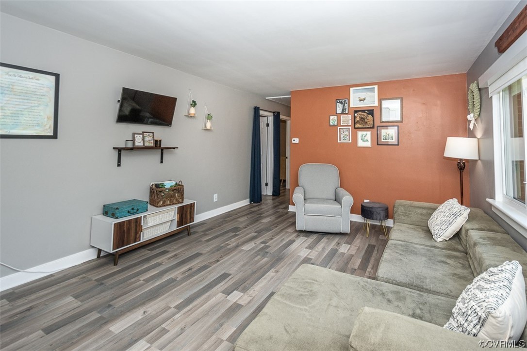 1025 Andros Road Richmond, VA 23225 - Photo 7 of 37 a living room with furniture and a flat screen tv