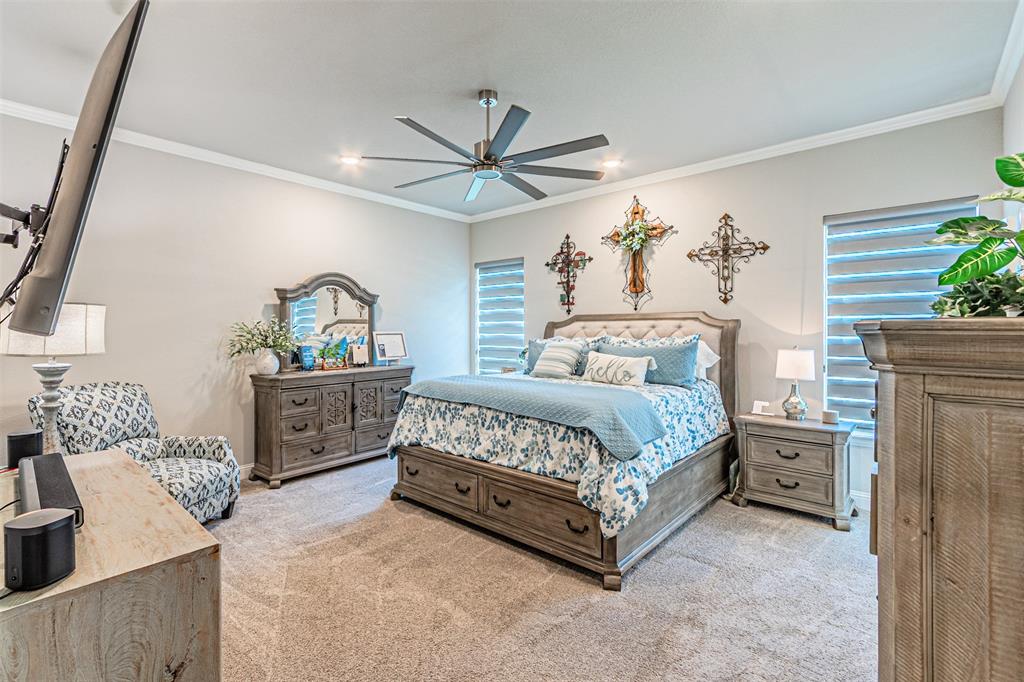 1009 Henry Way Springtown, TX 76082 - Photo 22 of 40 Carpeted bedroom featuring crown molding, ceiling fan, and recessed lighting