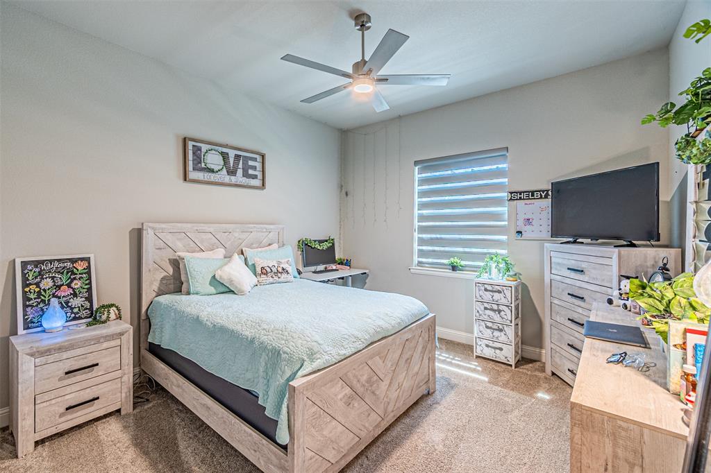 1009 Henry Way Springtown, TX 76082 - Photo 28 of 40 Bedroom with light colored carpet and ceiling fan
