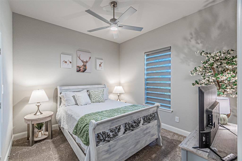 1009 Henry Way Springtown, TX 76082 - Photo 31 of 40 Carpeted bedroom with ceiling fan and baseboards