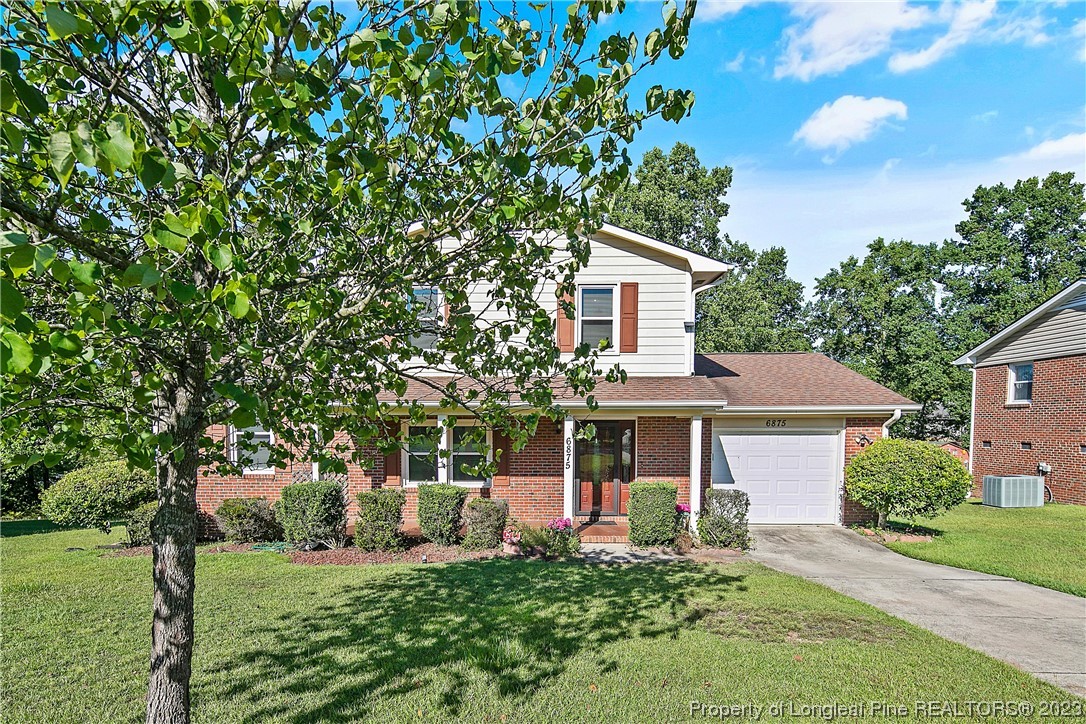6875 Baystone Road Fayetteville, NC 28314 - Photo 1 of 50 a front view of a house with a yard
