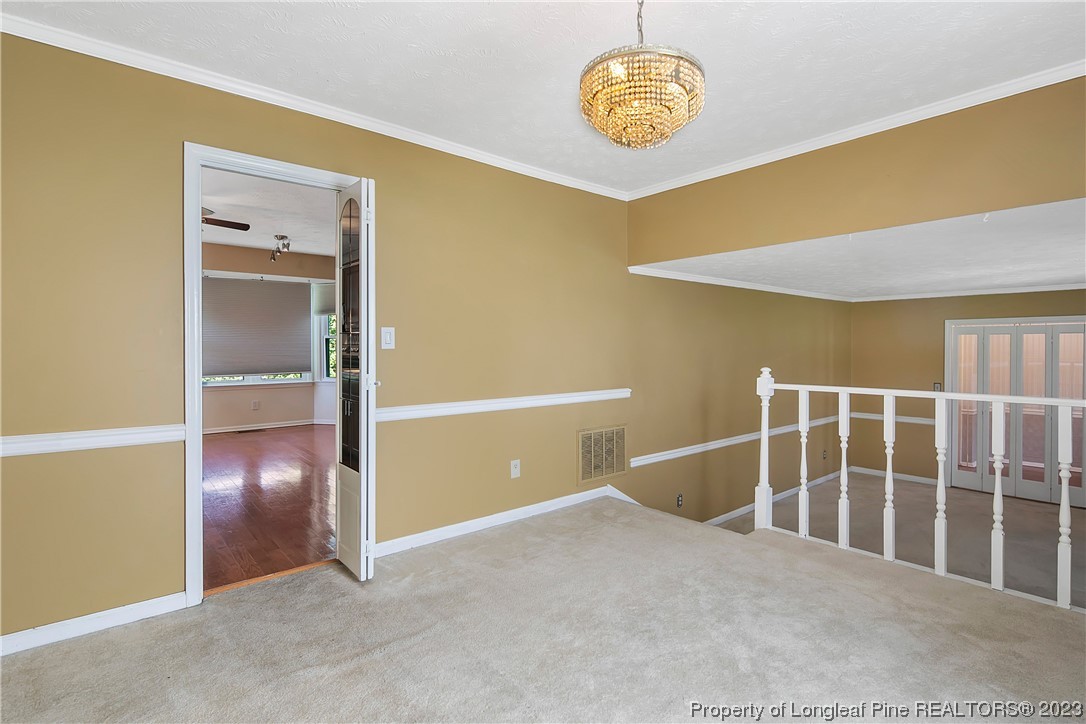 6875 Baystone Road Fayetteville, NC 28314 - Photo 13 of 50 a view of an empty room with a fan
