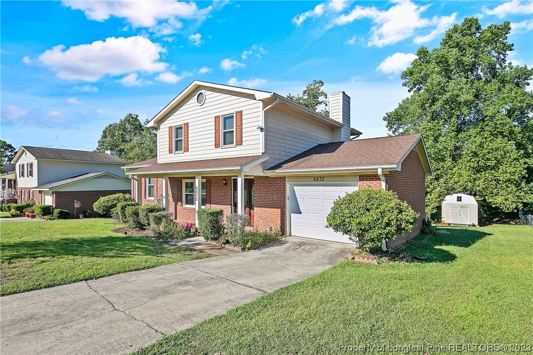 6875 Baystone Road Fayetteville, NC 28314 - Photo 2 of 50 a front view of a house with a yard and garage