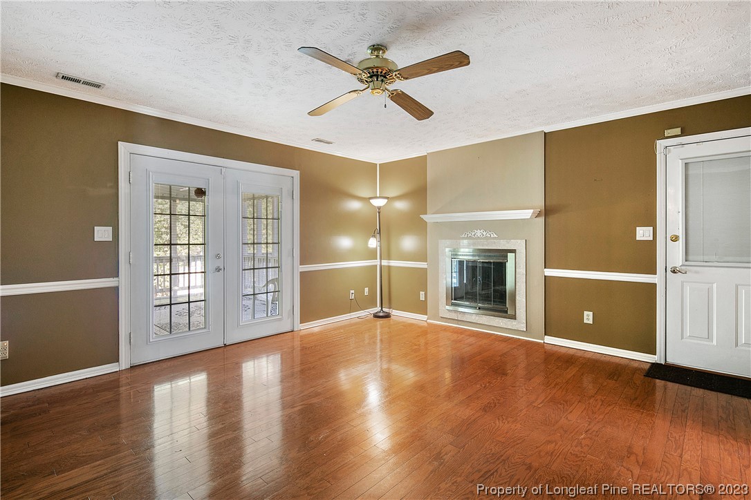 6875 Baystone Road Fayetteville, NC 28314 - Photo 25 of 50 a view of an empty room with window and wooden floor