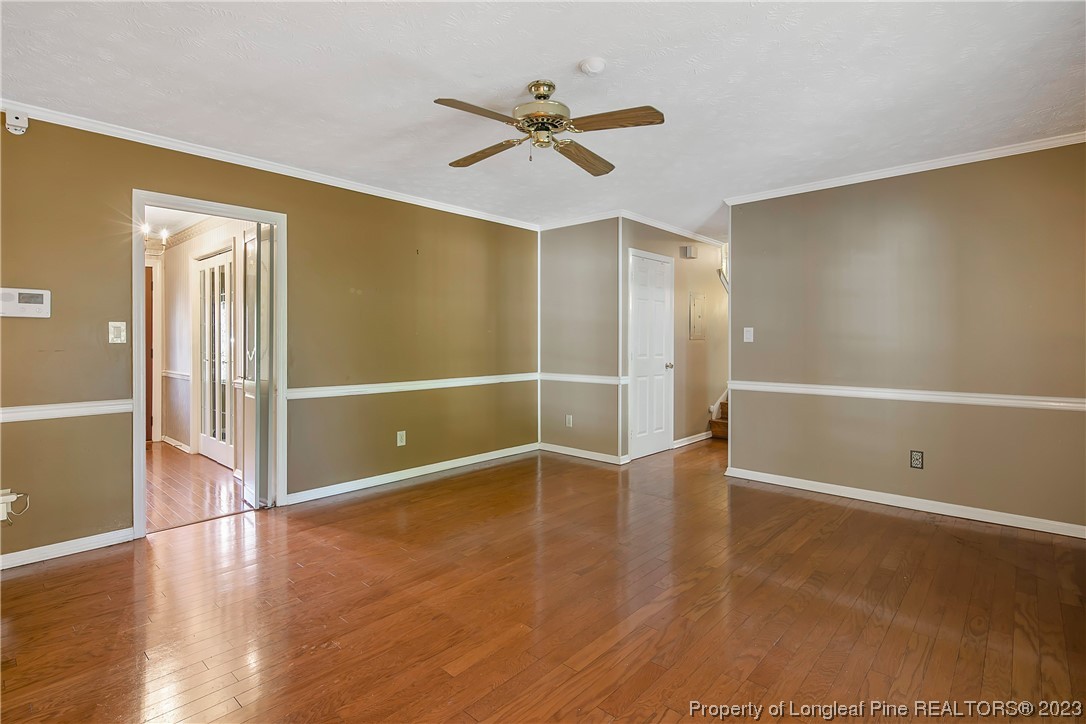 6875 Baystone Road Fayetteville, NC 28314 - Photo 27 of 50 a view of an empty room with wooden floor
