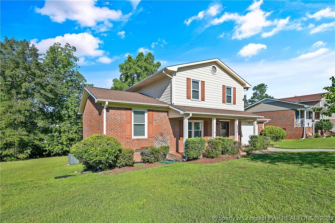 6875 Baystone Road Fayetteville, NC 28314 - Photo 3 of 50 a front view of a house with a yard
