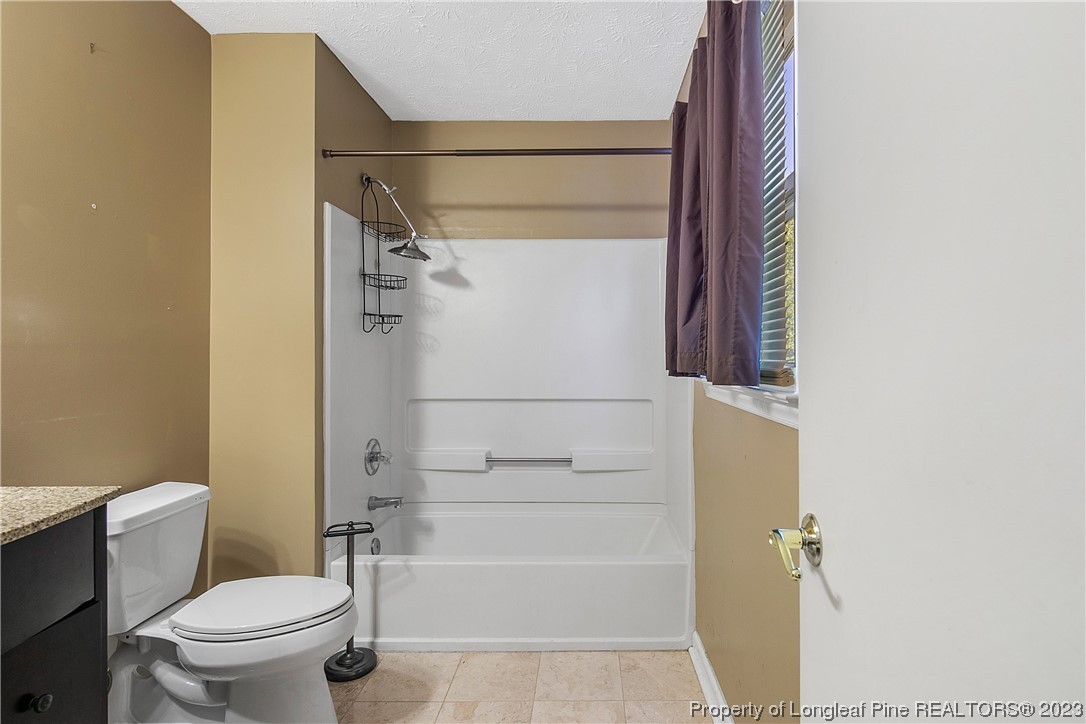 6875 Baystone Road Fayetteville, NC 28314 - Photo 33 of 50 a bathroom with a shower and a toilet