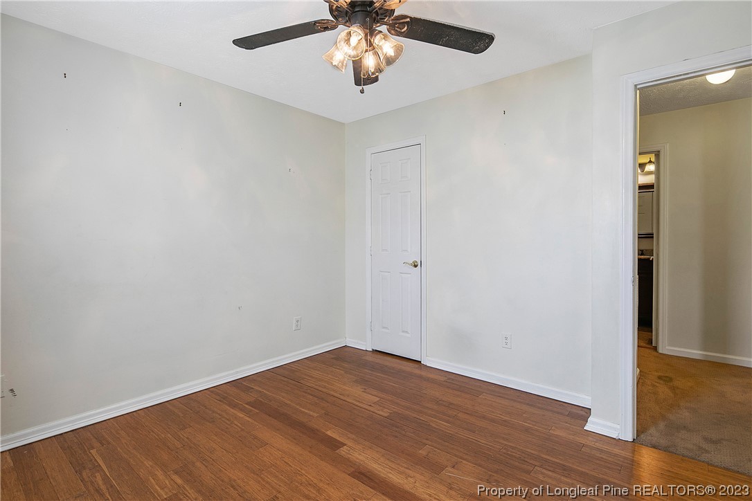 6875 Baystone Road Fayetteville, NC 28314 - Photo 36 of 50 wooden floor in an empty room with a window