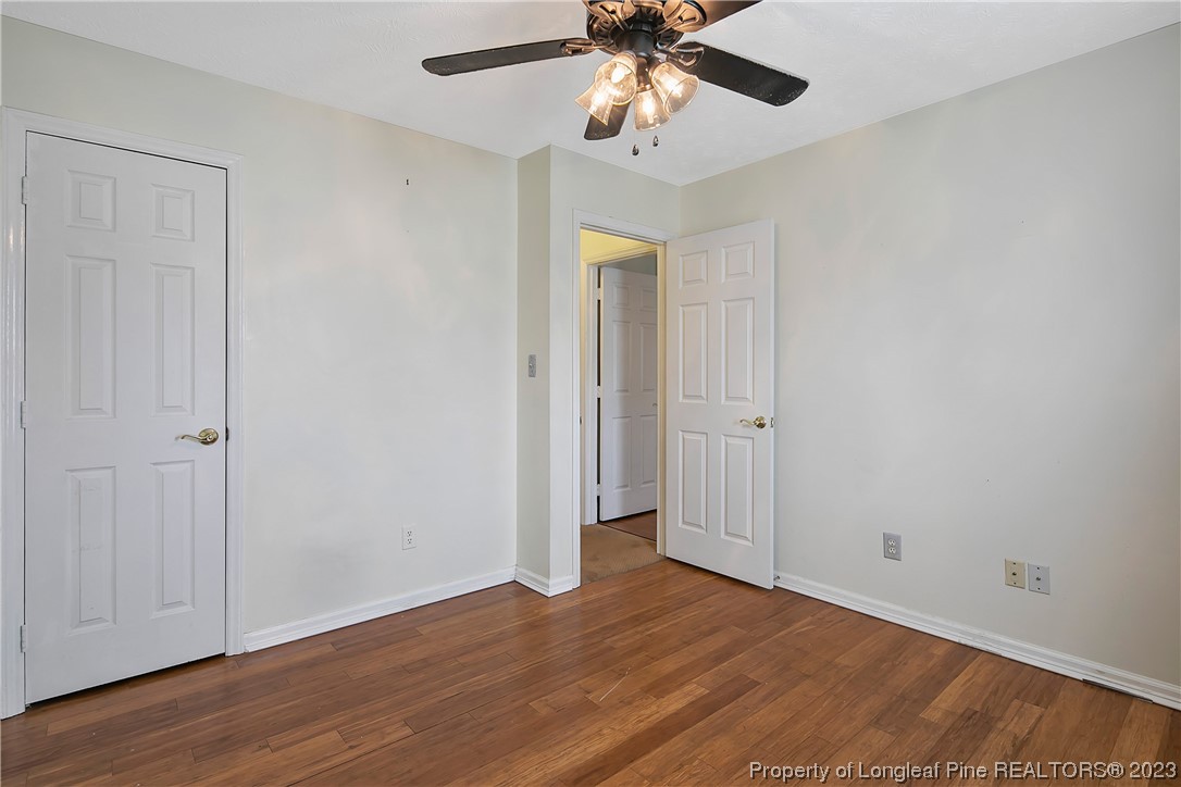 6875 Baystone Road Fayetteville, NC 28314 - Photo 37 of 50 a view of an empty room with wooden floor