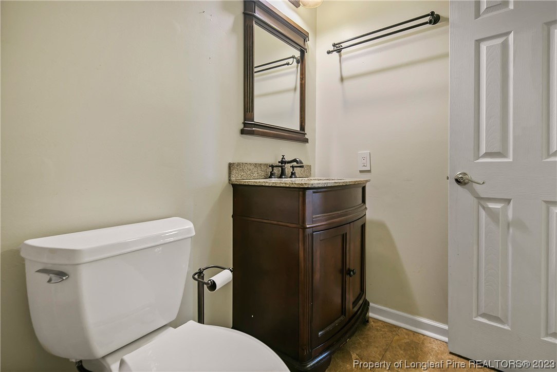 6875 Baystone Road Fayetteville, NC 28314 - Photo 40 of 50 a bathroom with a toilet sink and mirror