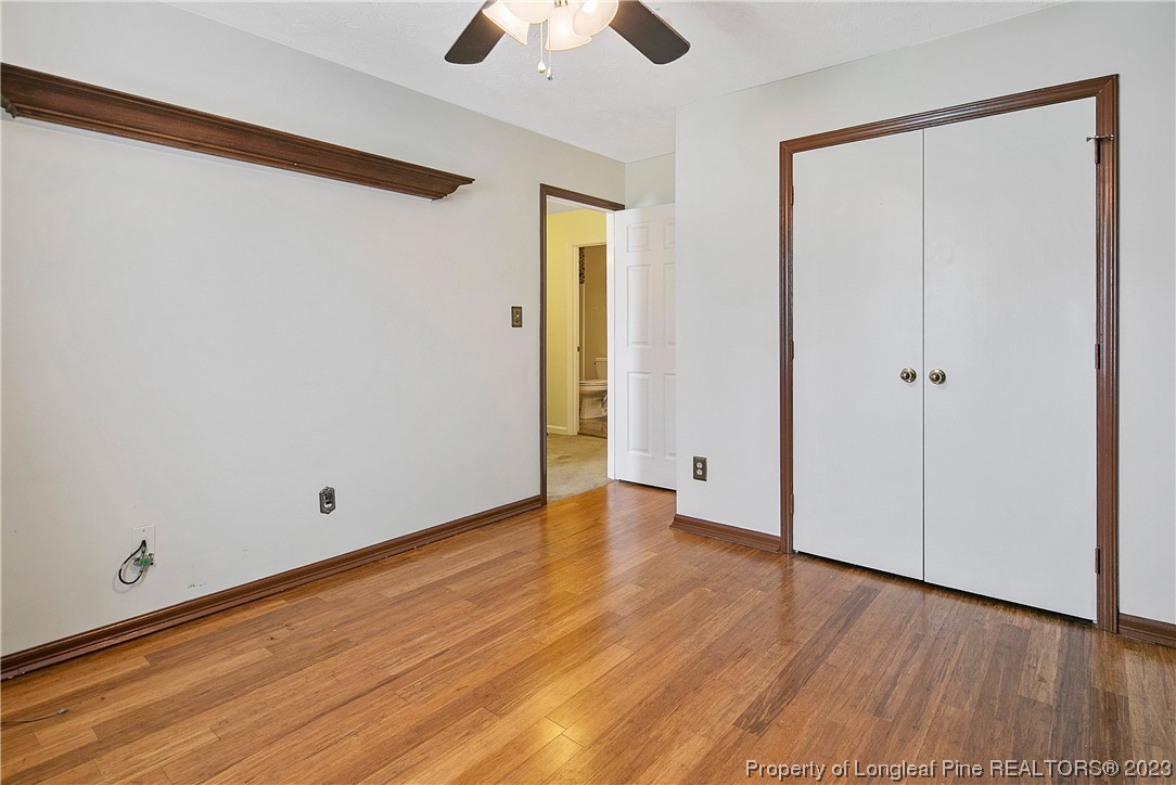 6875 Baystone Road Fayetteville, NC 28314 - Photo 43 of 50 a view of an empty room with wooden floor